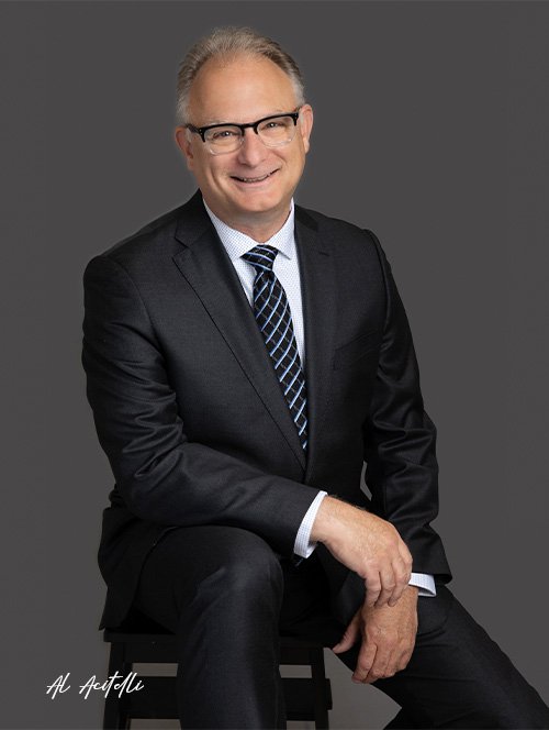 Photo of Al Acitelli wearing a suit